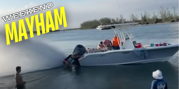 Boneheaded Boaters trying to push a beached boat off a sandbar