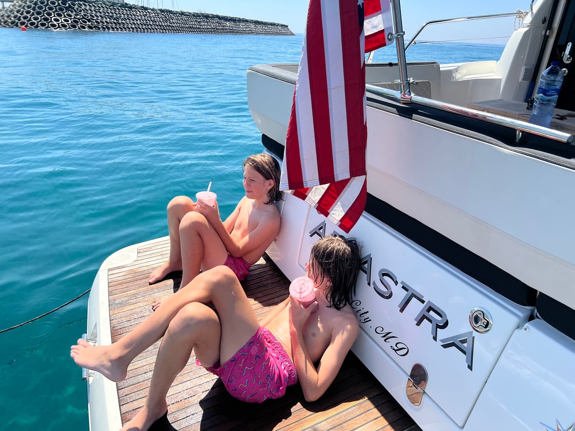 Enjoying a Cool Drink After a Swim in the Med