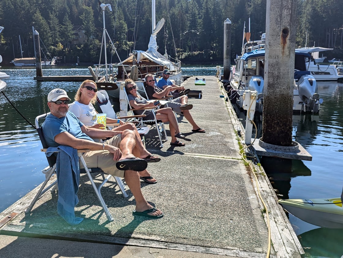 Friends, enjoying some late summer dock time at Pleasant Harbor in Washington state.