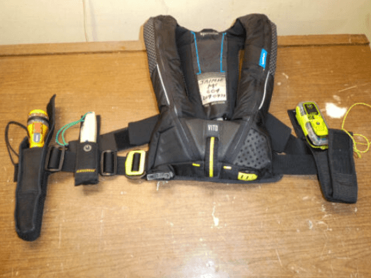 PFD with solo sailing safety gear