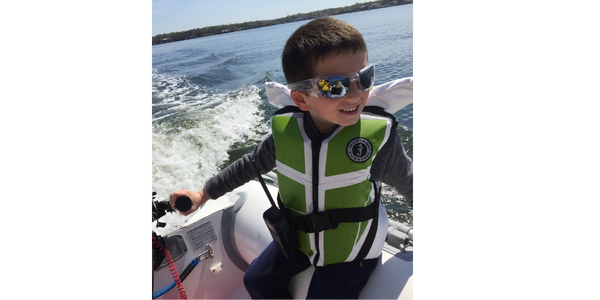 In Manhasset Bay, NY. Future skipper “Capt. Jack” was in training to learn the ropes of safe dinghy navigation