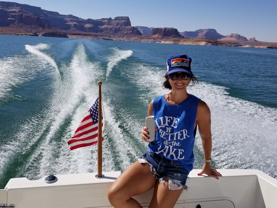 That is my daughter,  Lauren Biagi at Lake Powell on a Bayliner 288 cabin cruiser. Terry Biagi