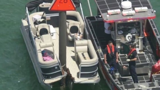 birds eye view of a Pontoon boat crashed into a chanel marker